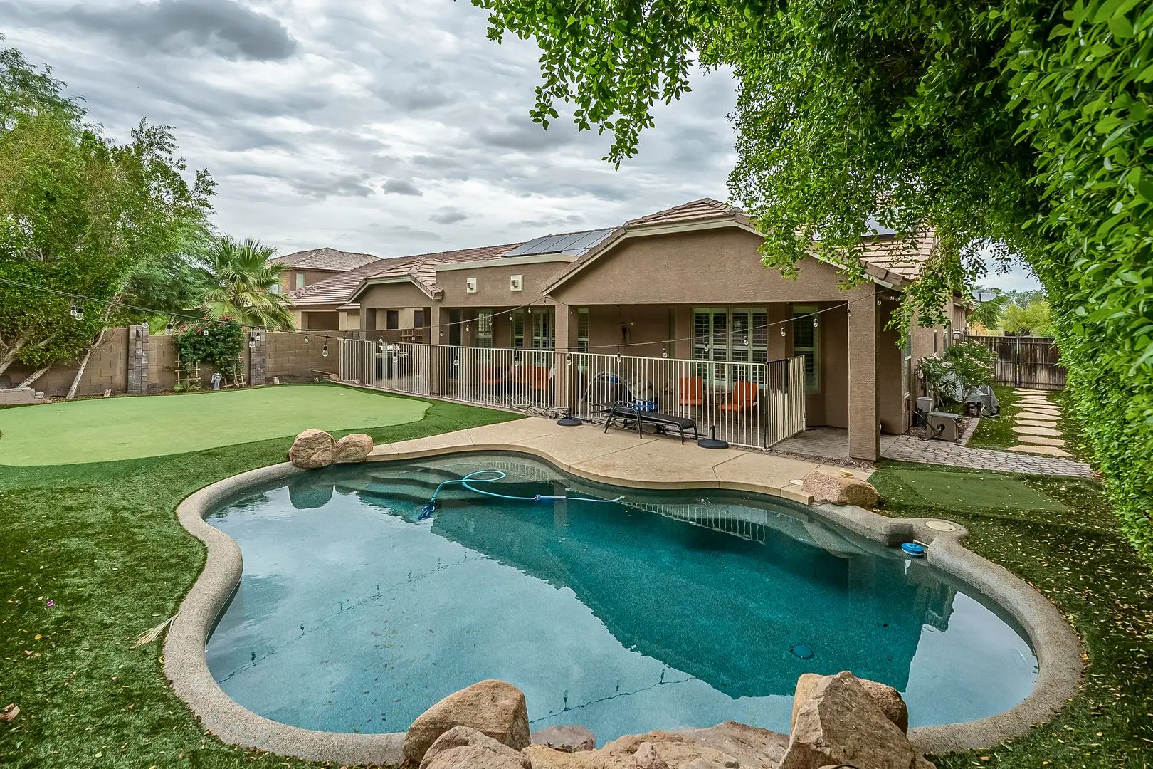 Phoenix Pool Home | 4 Bedrooms, Solar + Backyard Putting Green photo 2