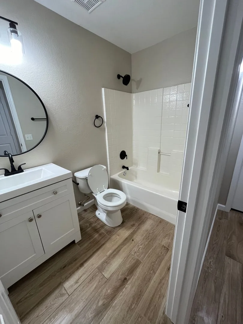 Johnson Ranch, 3 bed, 2 bath, single story, remodeled: wood tile flooring photo 3